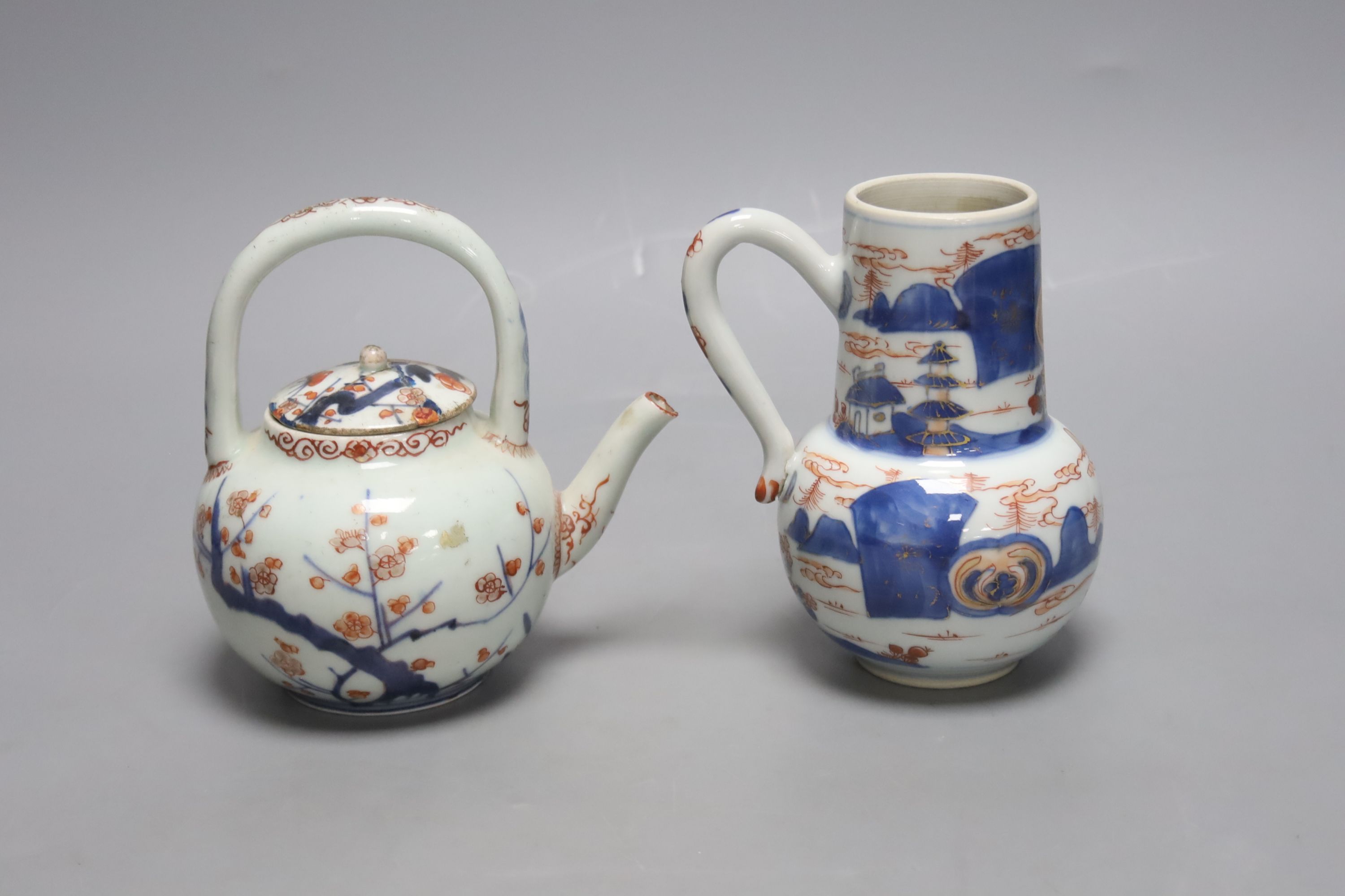 A pair of 18th century Chinese Imari style dishes, diameter 22.5cm, together with a similar chocolate pot and an 18th century Japanese Arita teapot, associated cover